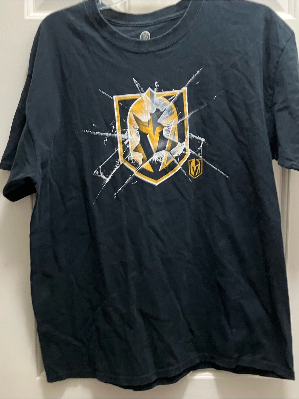 Vegas Golden Knights graphic t-shirt features a shattered glass effect Large